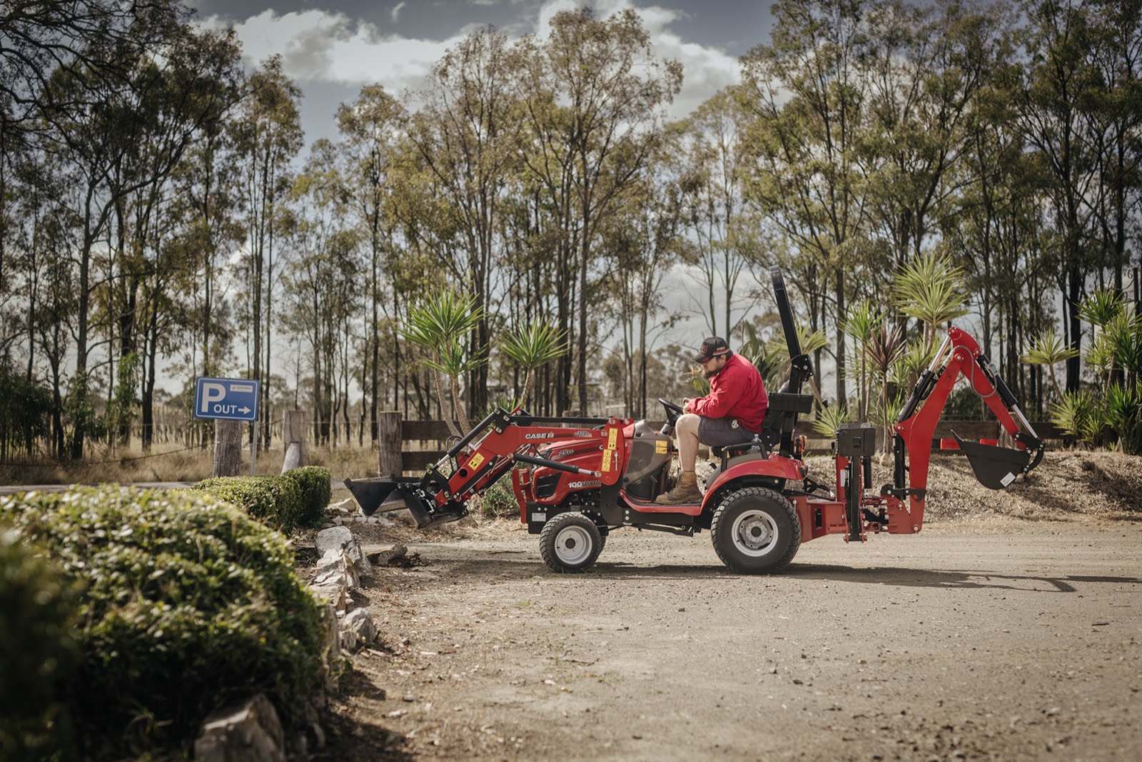 Case IH compact tractor working on farm