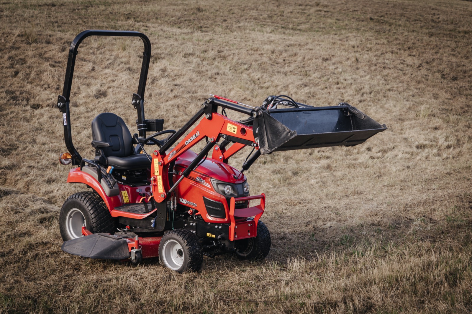 Case IH compact tractor working on farm