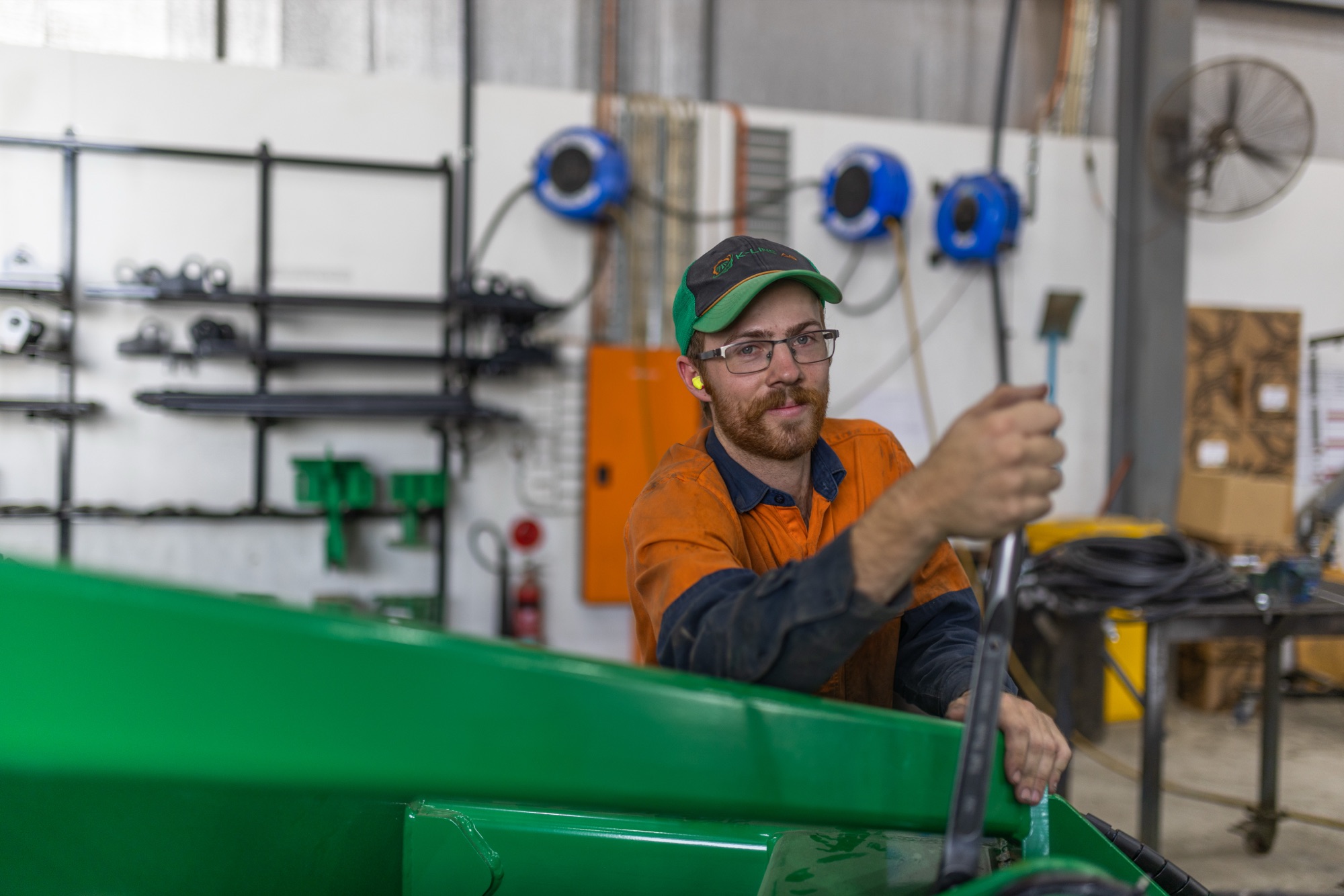 Workers assembling tillage machinery on the Agtechnic factory floor