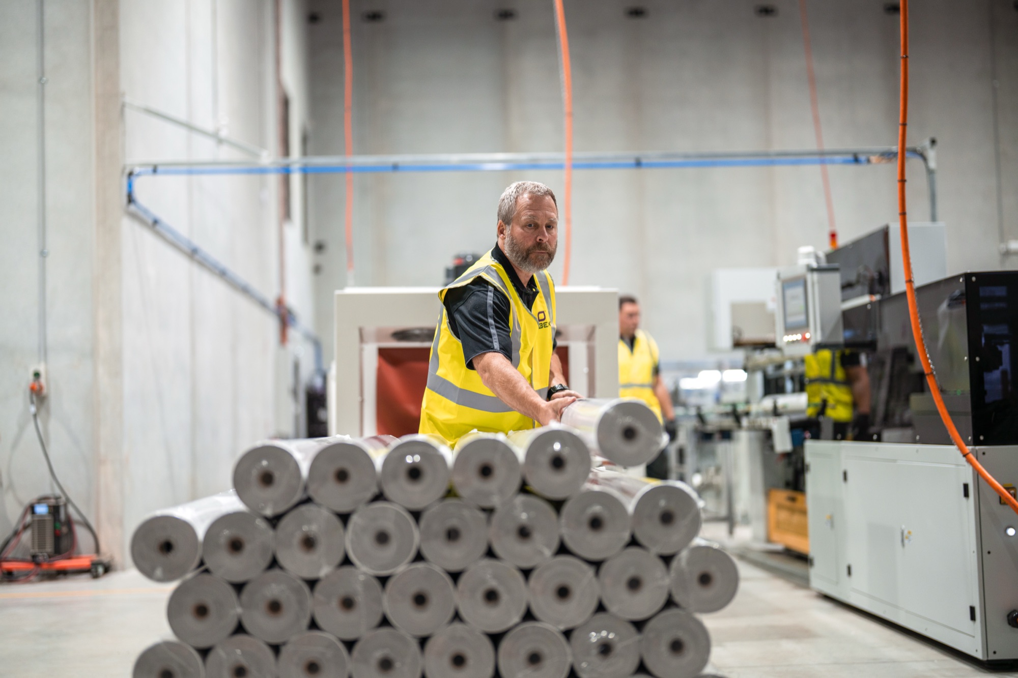 Finished rolls stacked on the Obex factory floor